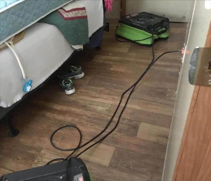 Air movers in a bed room.