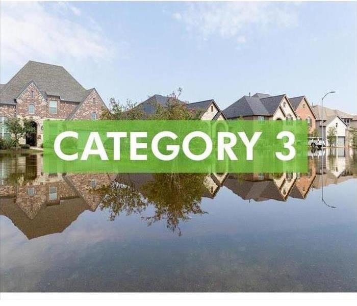 Flooded homes with sign that say "CATEGORY 3"